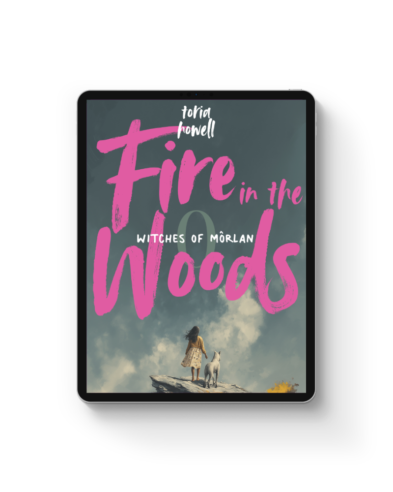 Book cover titled 'Fire in the Woods' by Toria Howell, featuring an illustration of a girl and a large white puppy standing on a rocky ledge looking at a cloudy sky.