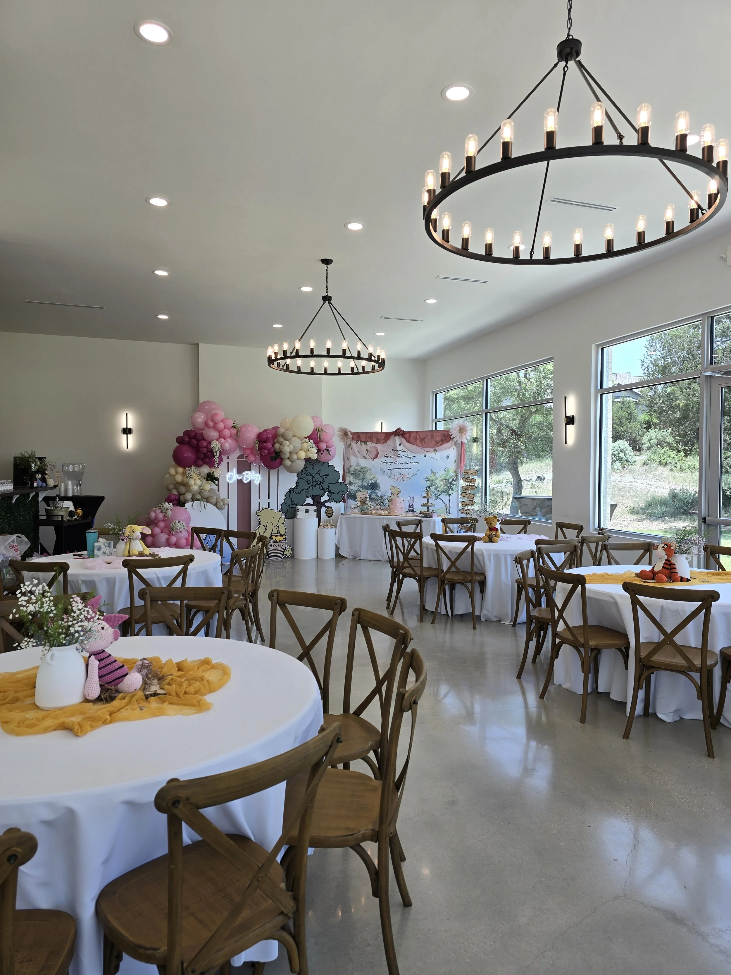 Bright, colorful baby shower decorations in sunlit space
