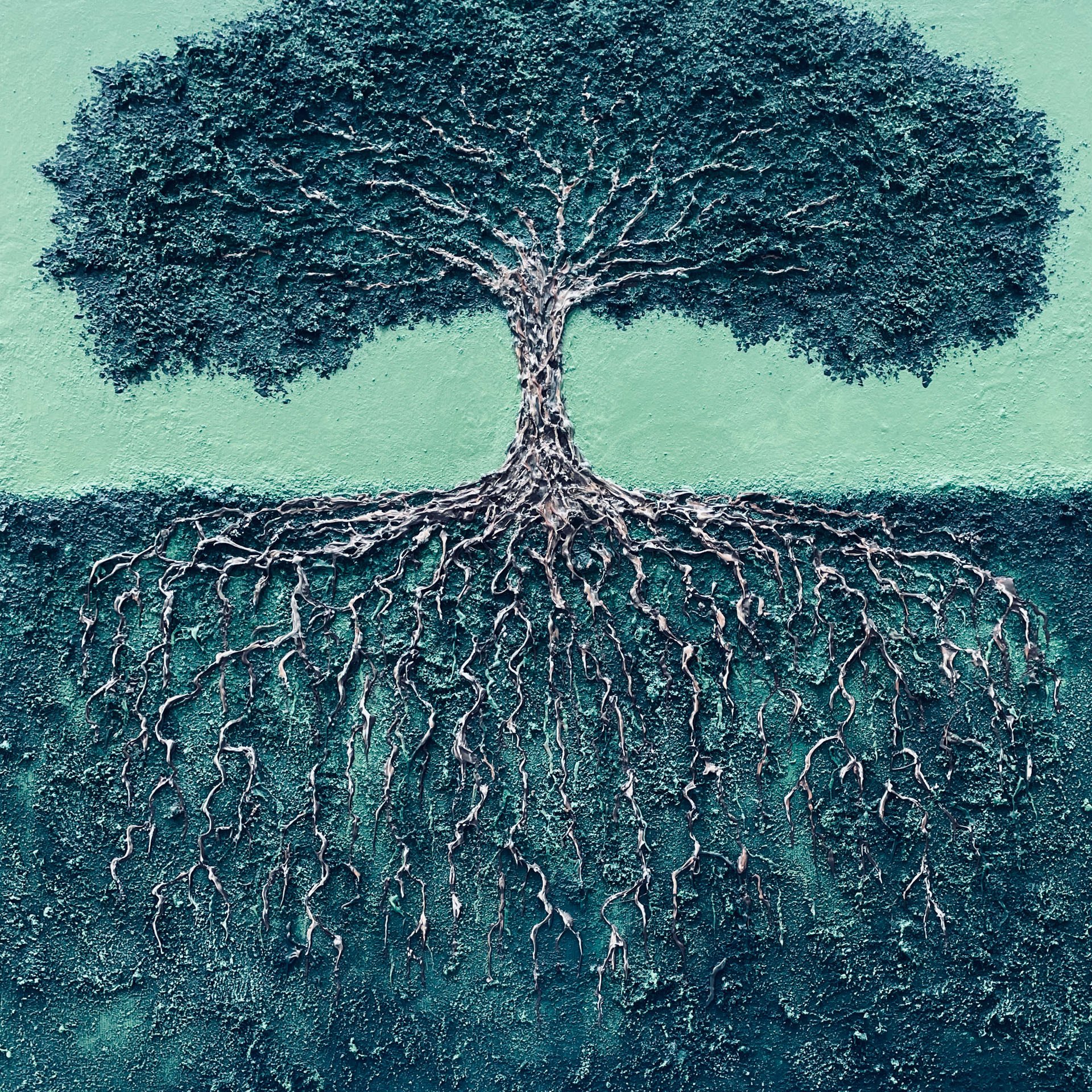 A textured mural of a tree with a detailed network of roots on a green background.