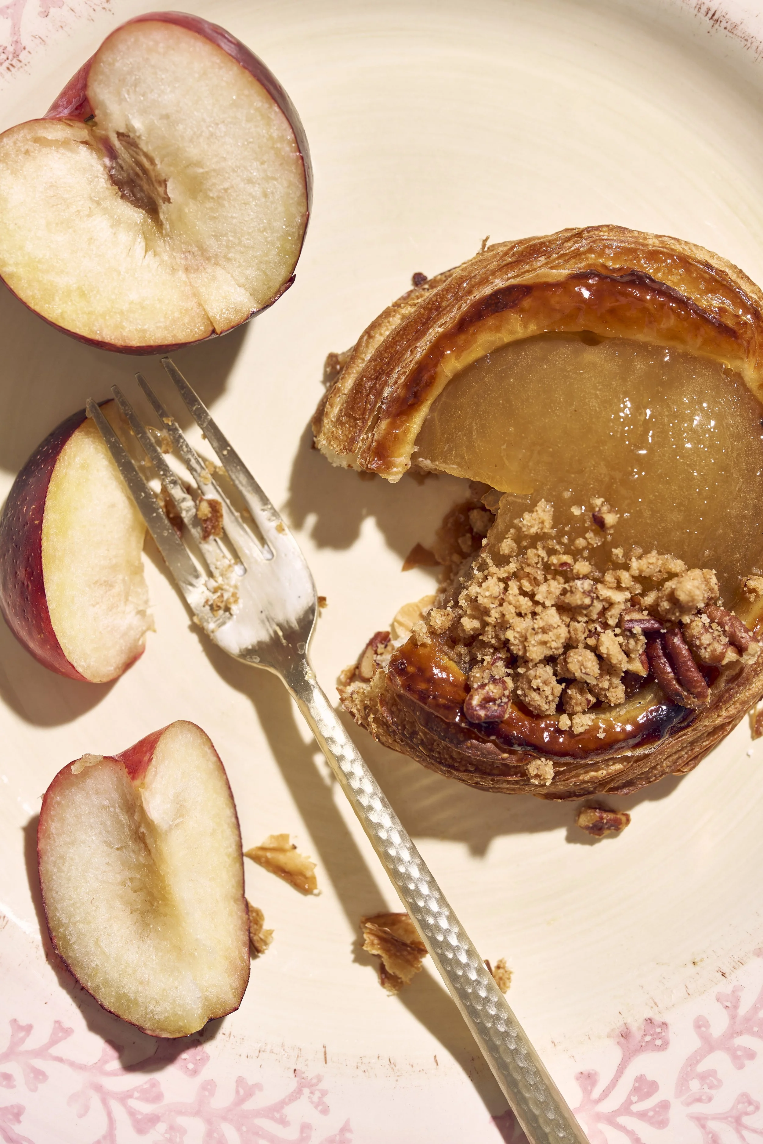 Denver editorial and commercial photographer pastry on a floral dish with gold fork