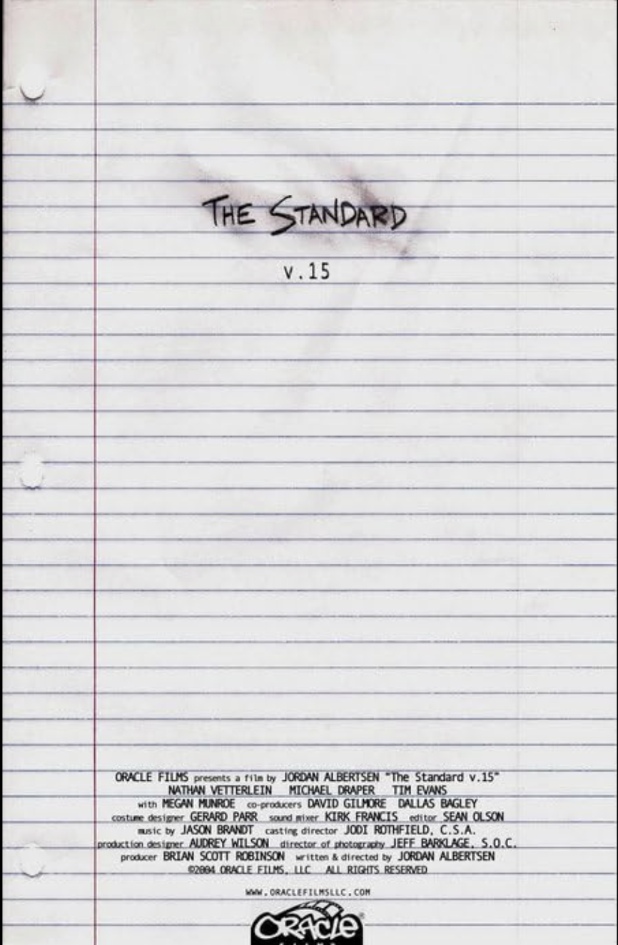 A sheet of lined notebook paper with the title "The Standard v.15" written in black, with credits and production information printed in small text at the bottom.
