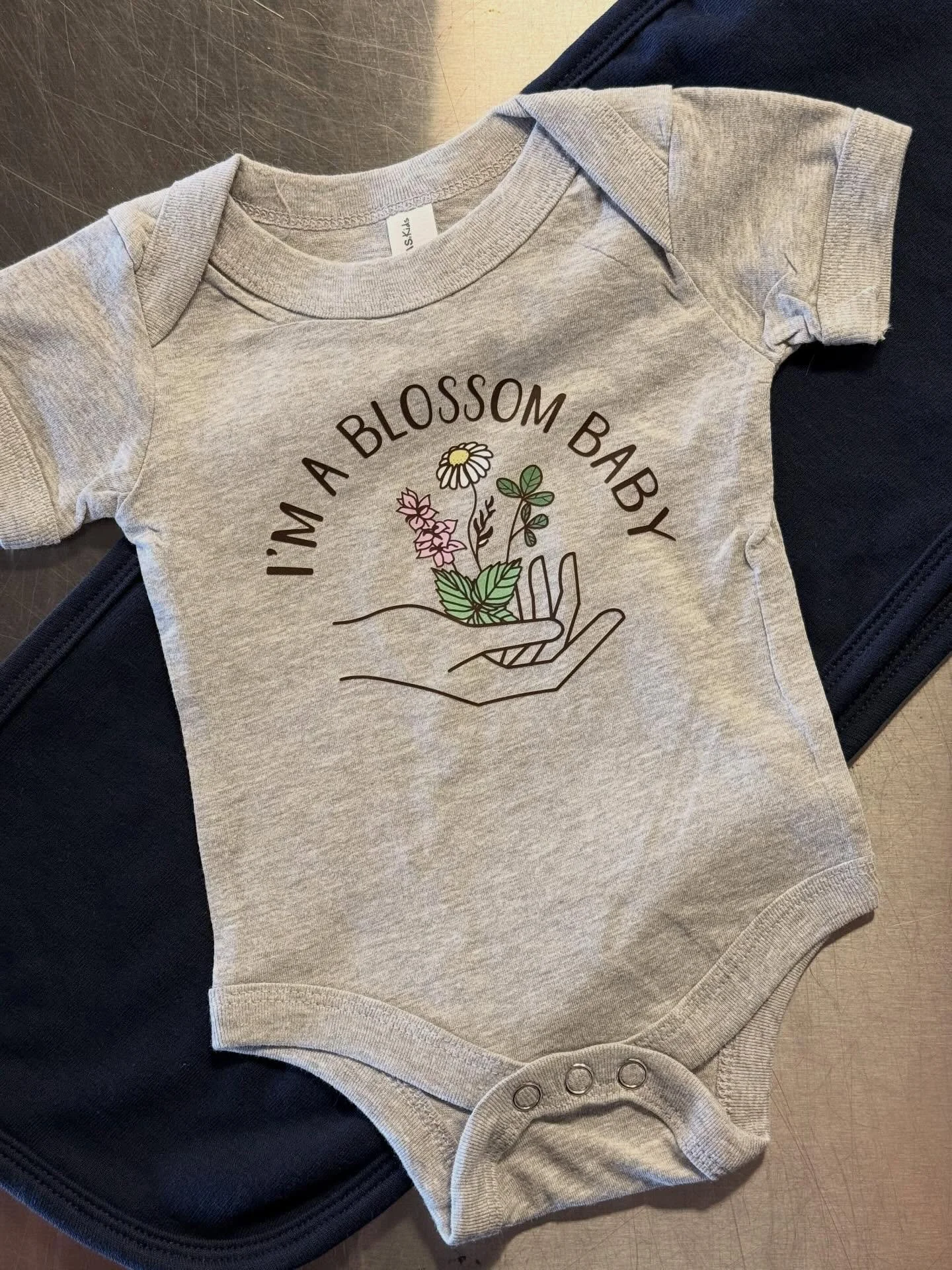 @blossommidwiferykc with a fresh set of onesies for the new babies! #kansascity #shoplocalkc