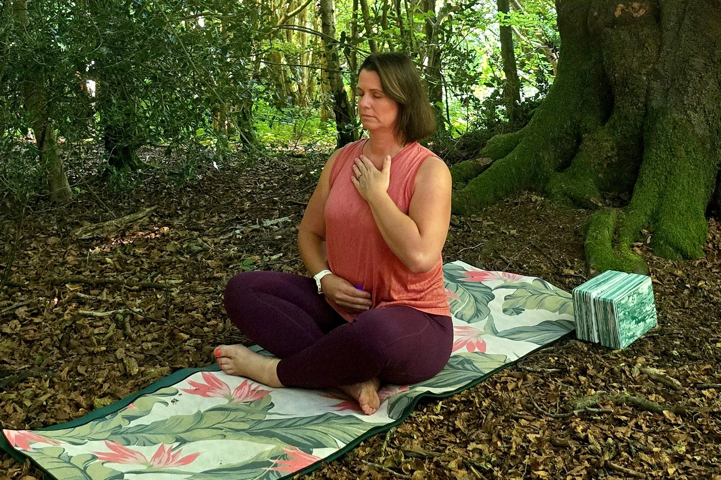 Chantelle under an ancient tree, practicing calming breathwork