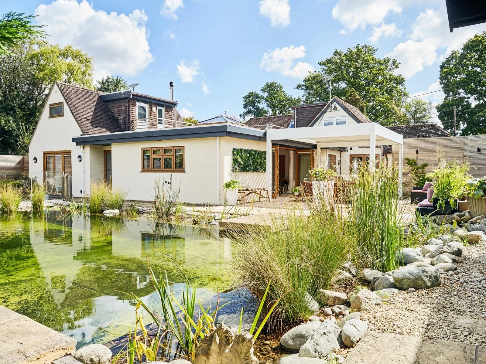 Retreat House with a view of a swimming pond and outside decking