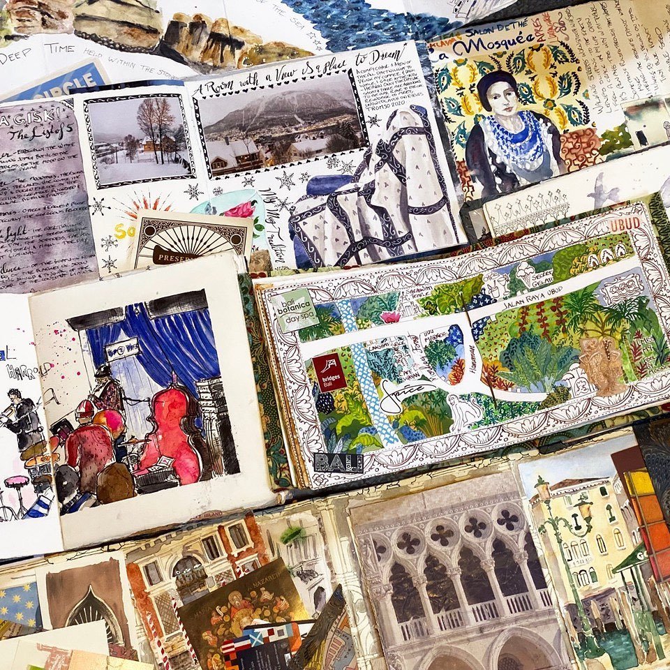 many travel art journals and travel sketchbooks laid out by Galia Alena