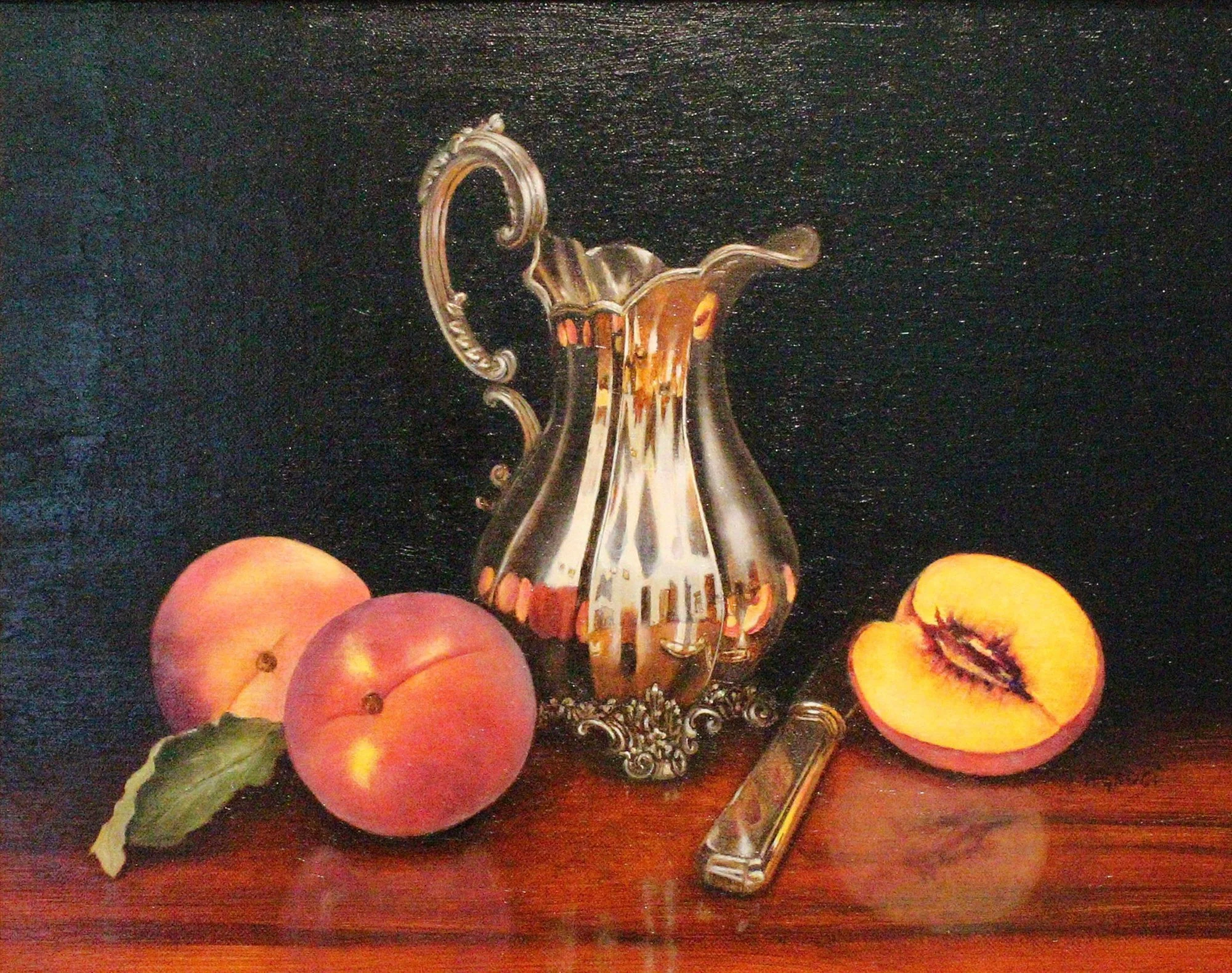 A still life painting featuring two peaches, one sliced open to reveal its inner flesh and pit, a decorative silver pitcher, and a silver-handled pocket knife on a dark wooden surface with a black background.