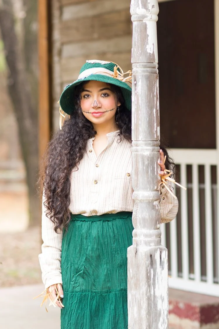 Emily Garcia as the Scarecrow