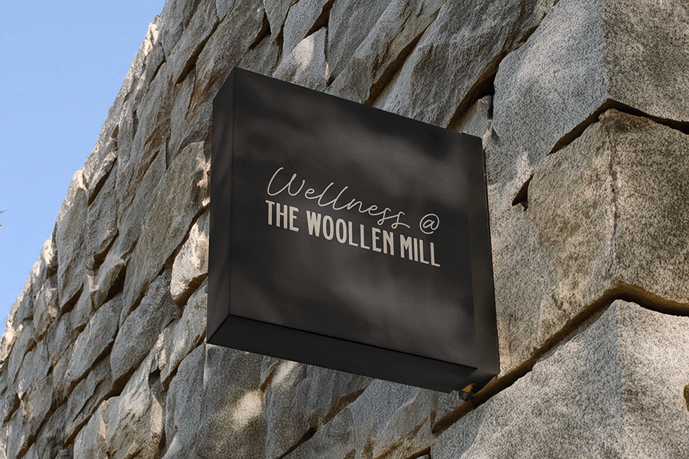 Wellness @ The Woollen Mill Sign.png