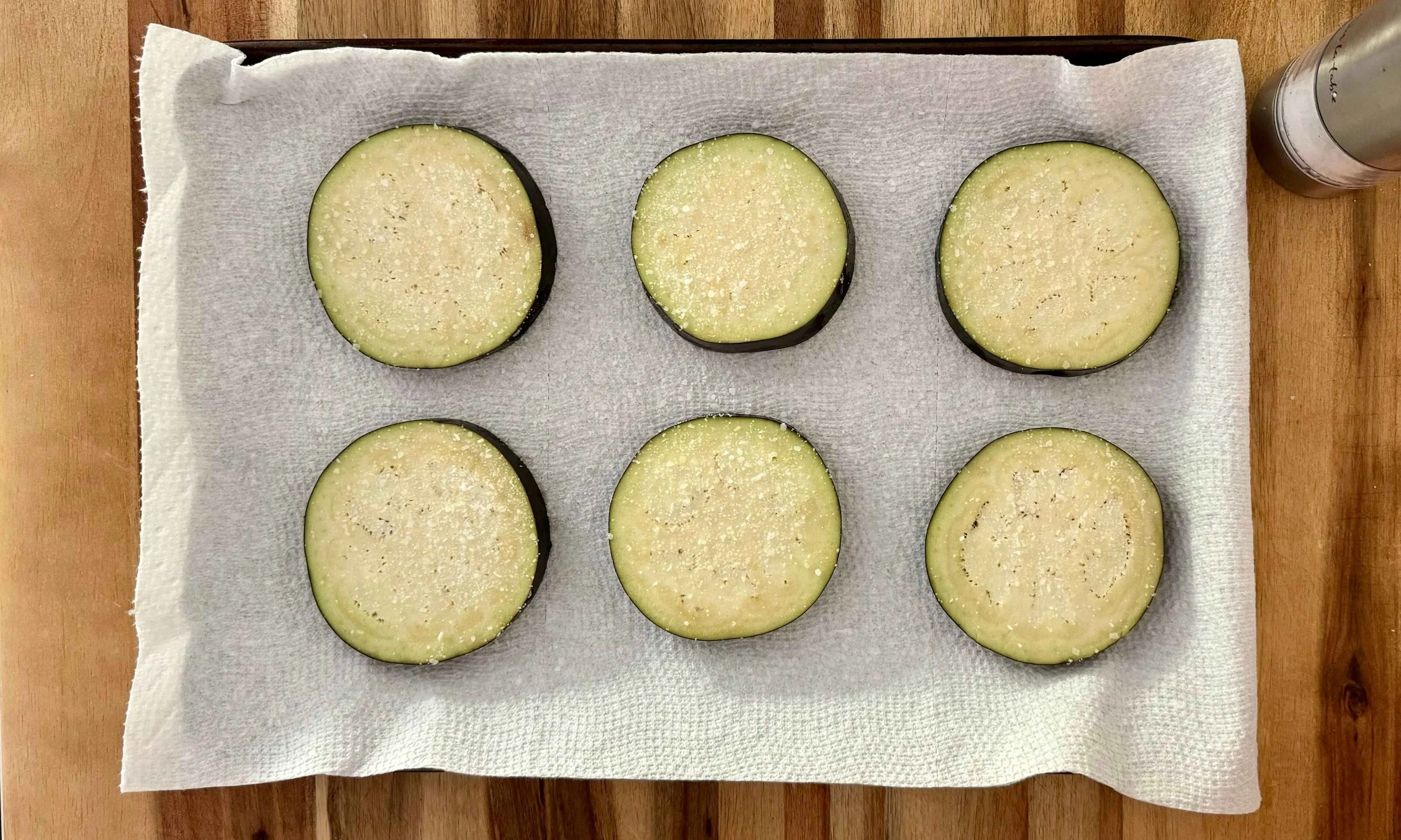 photo of 6 eggplant slices that have been salted