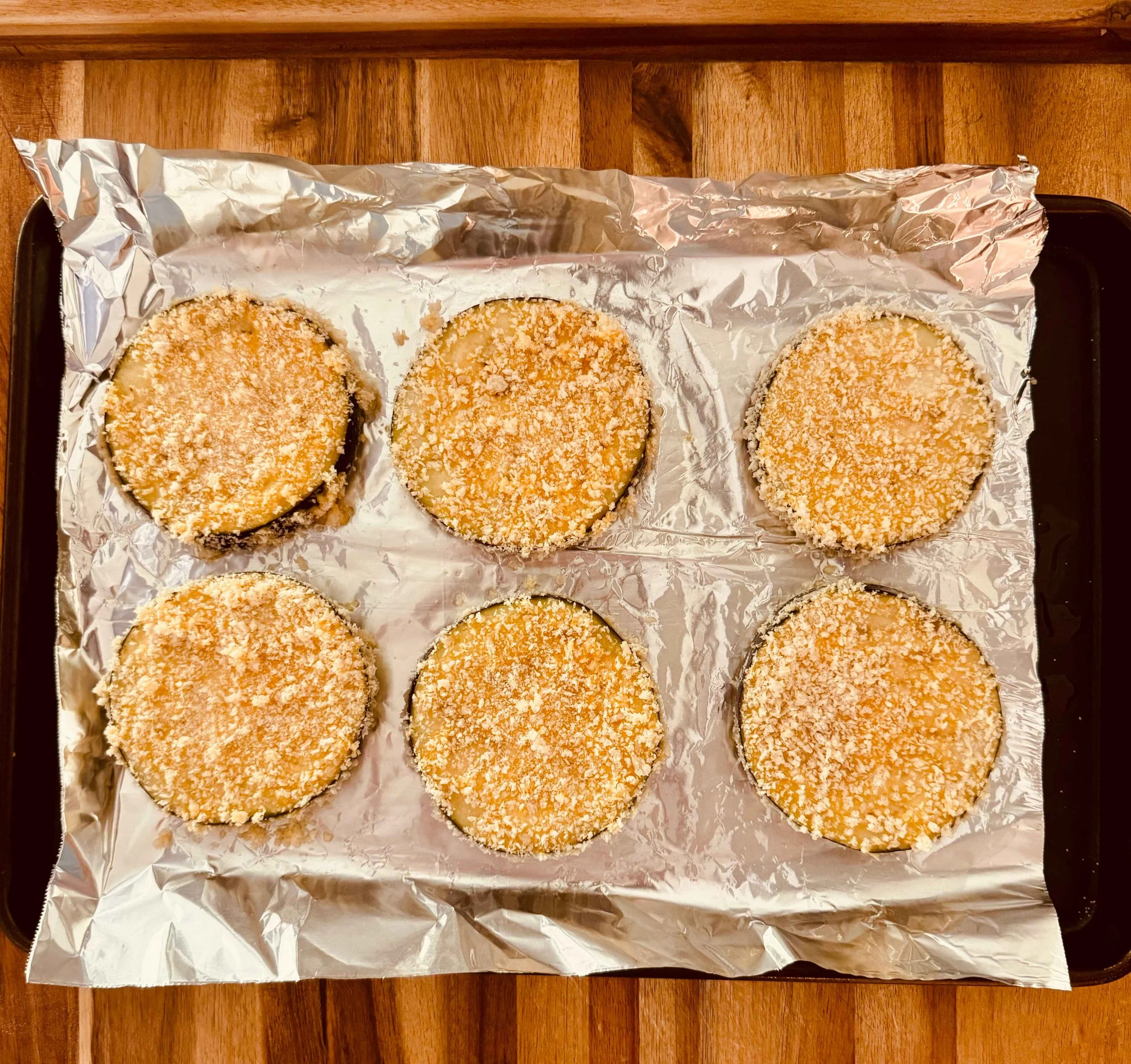 Photo of 6 eggplant slices fully breaded