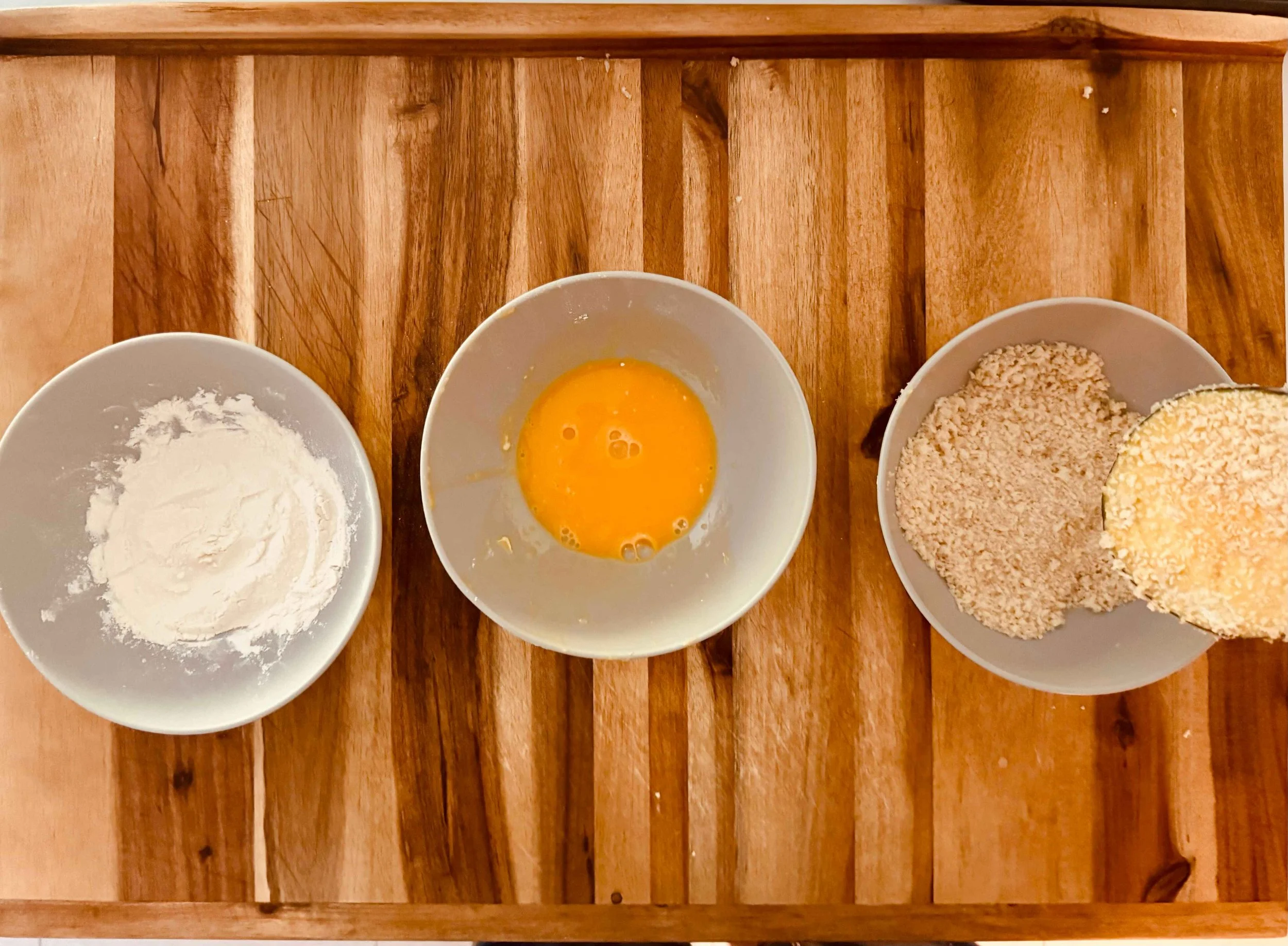 photo of an eggplant slice dipped in Panko