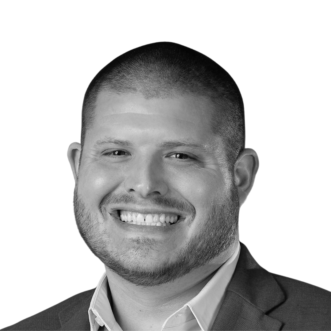 Black and white portrait of a smiling man in a business suit