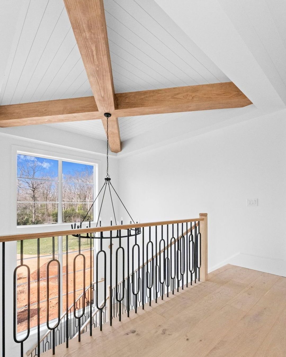 These massive exposed beams are the perfect focal point in the entryway to compliment the dramatic stairwell windows. More updates coming very soon!

#LuxuryLivingCLT #CharlotteHomes #CustomHomeBuilder #CLTRealEstate #DreamHome #CharlotteLuxuryHomes#