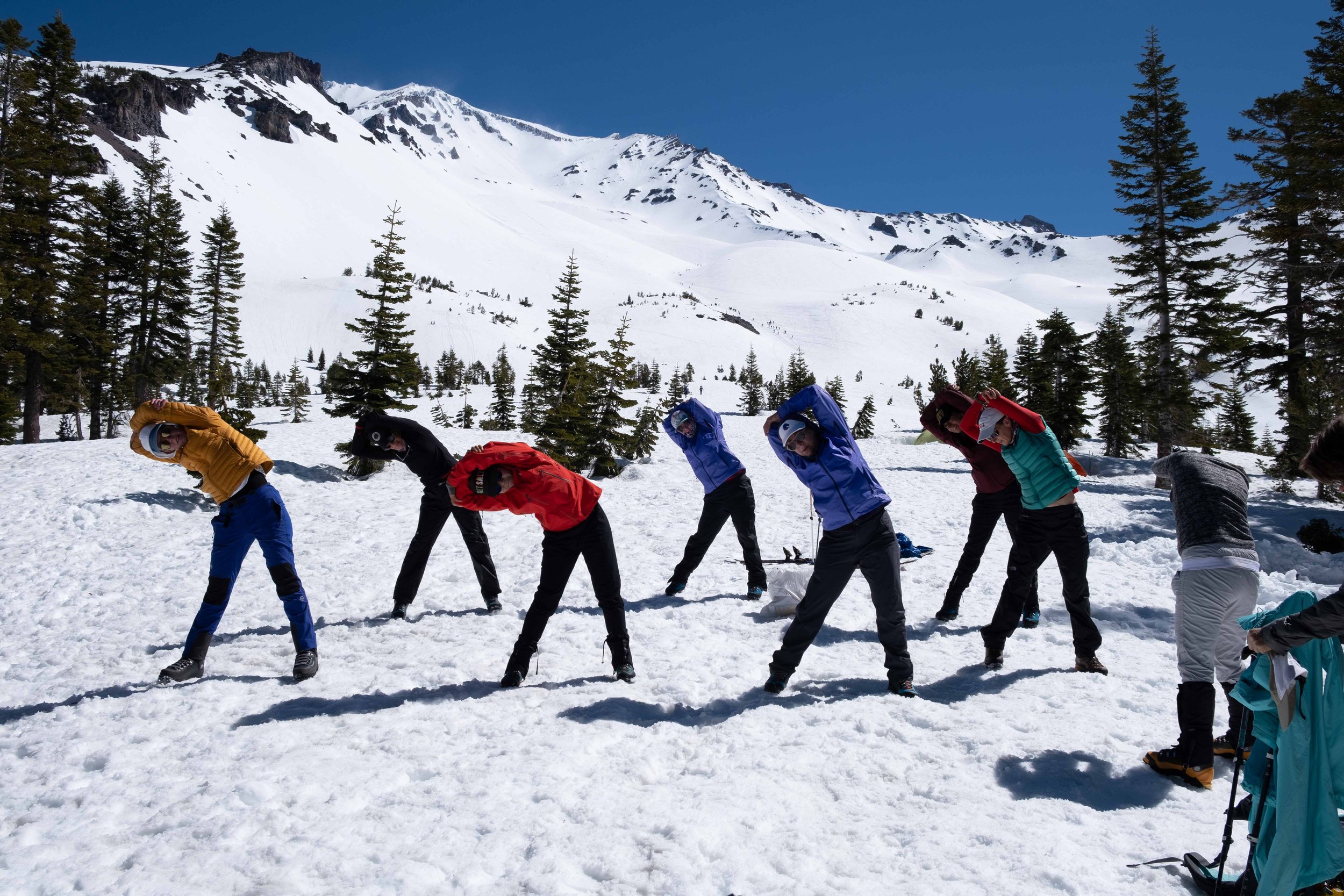 Women mountaineers wake up with morning yoga