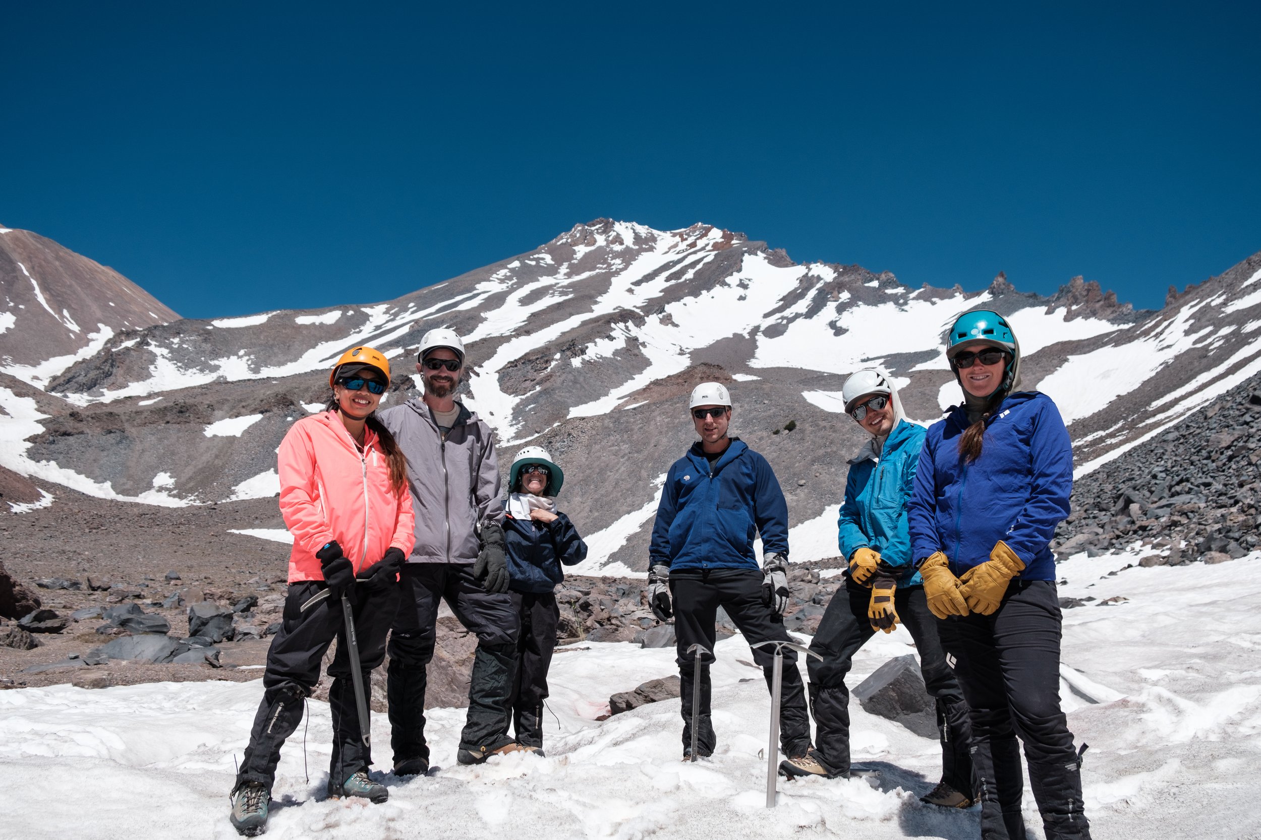 Mountaineering group poses at 50/50 base camp