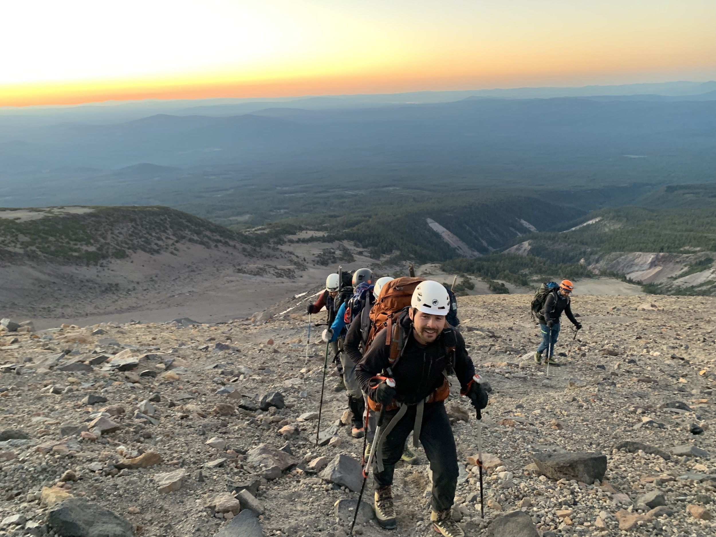 Mt Shasta climber hikes up the rocky terrain of the clear creek route