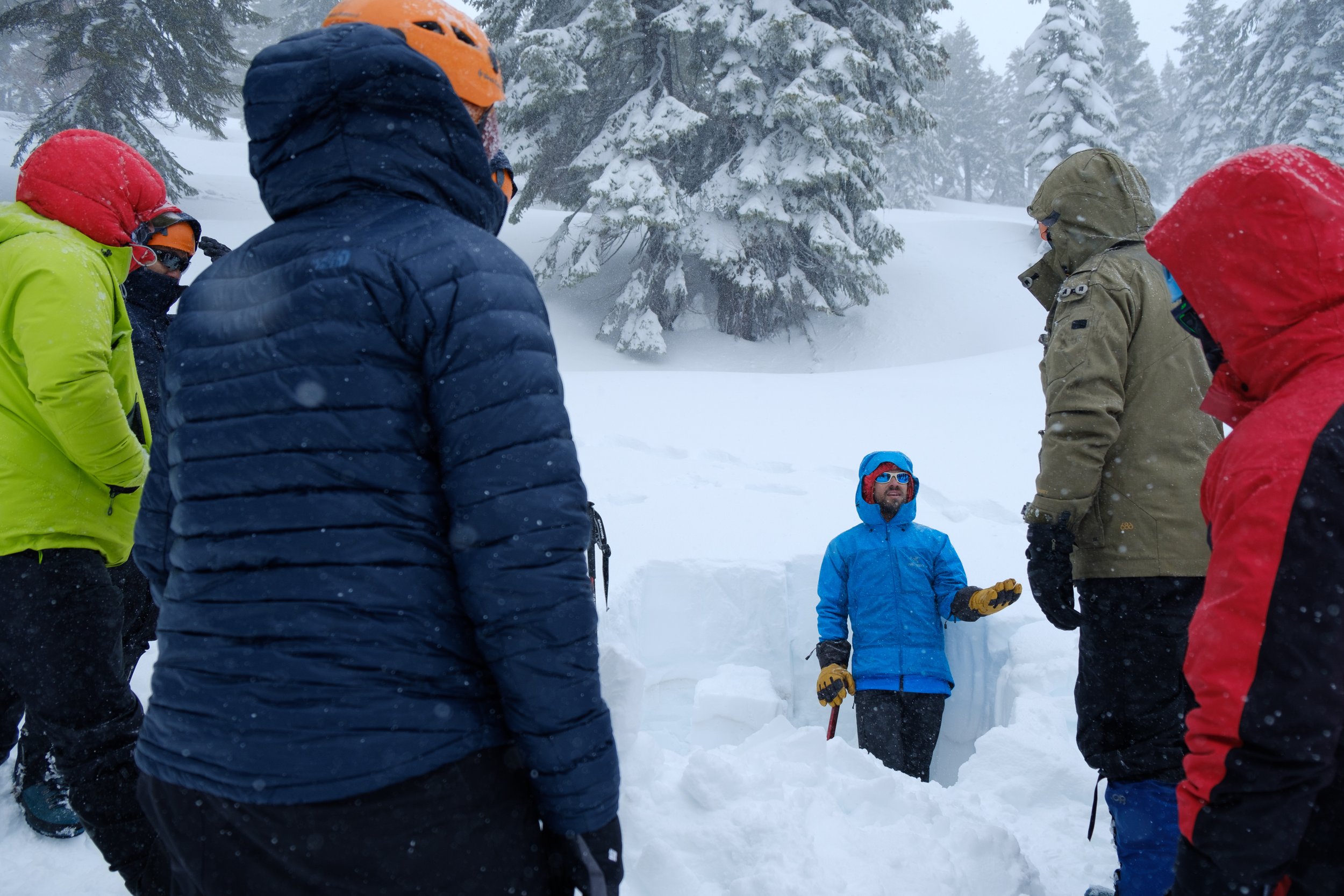 Avalanche course participants learn about different layers of snow.