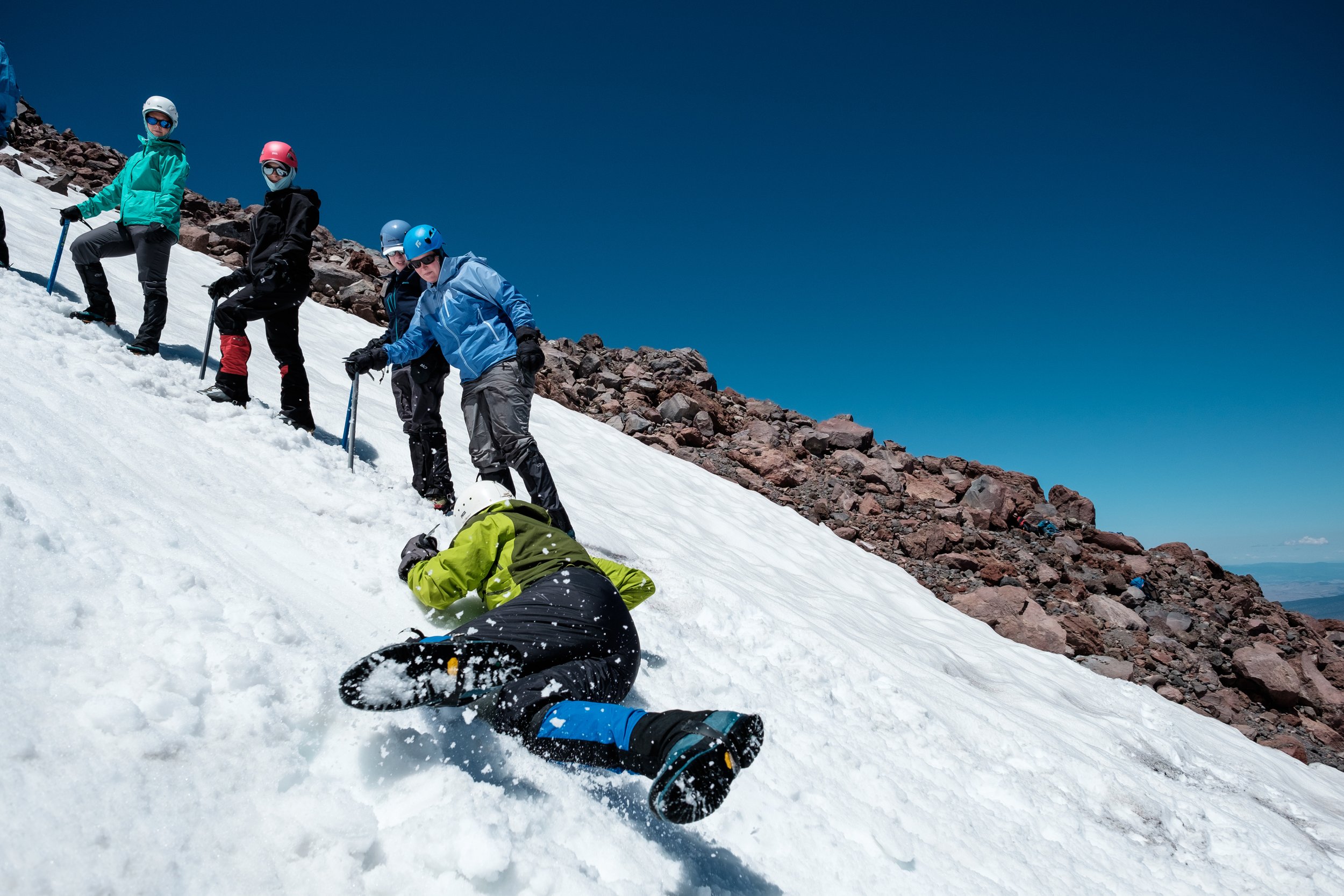 Course participant practices self arresting during the glacier travel and crevasse rescue course on mt shasta