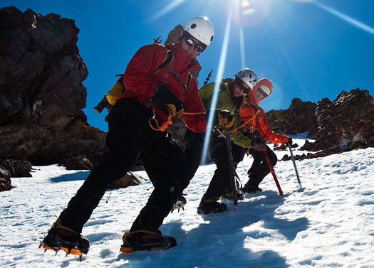 Climbers work on crampon technique while decent from their mt shasta summit