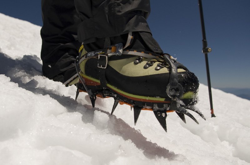Crampons and boots in the snow.