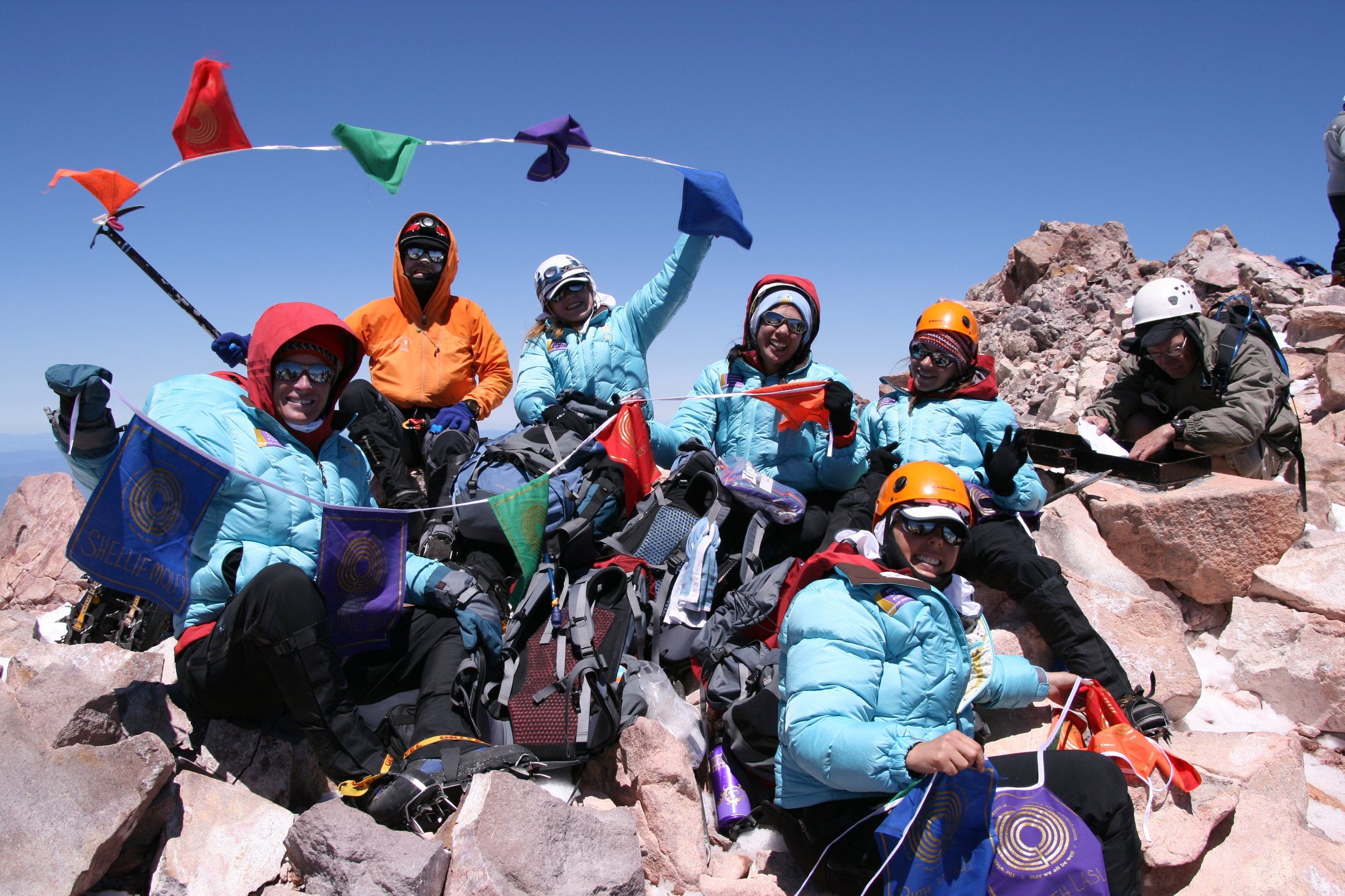 Climbers celebrate at the summit of mt shasta