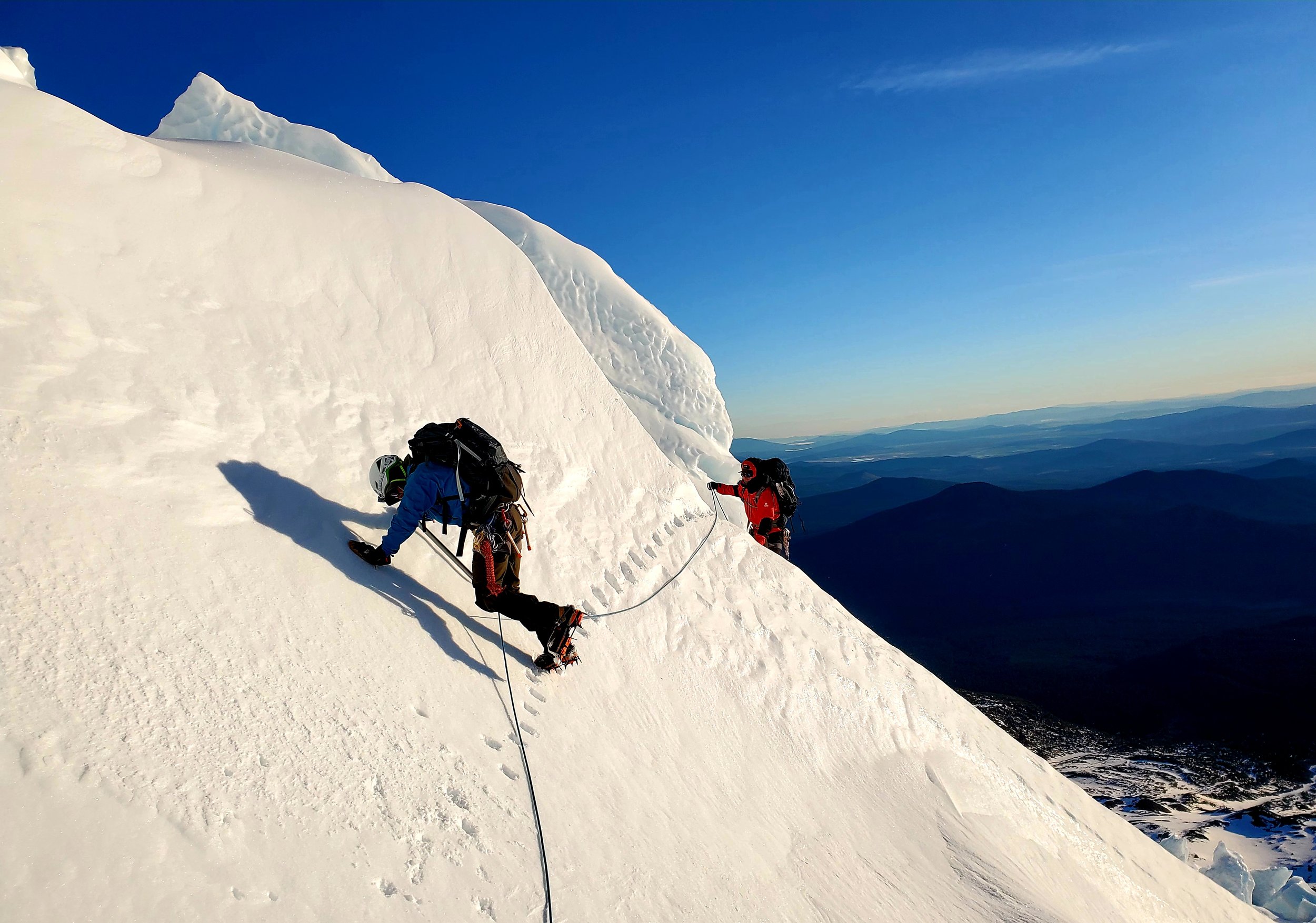 Mountaineer traverses across a glacier while attempting to summit mt shasta