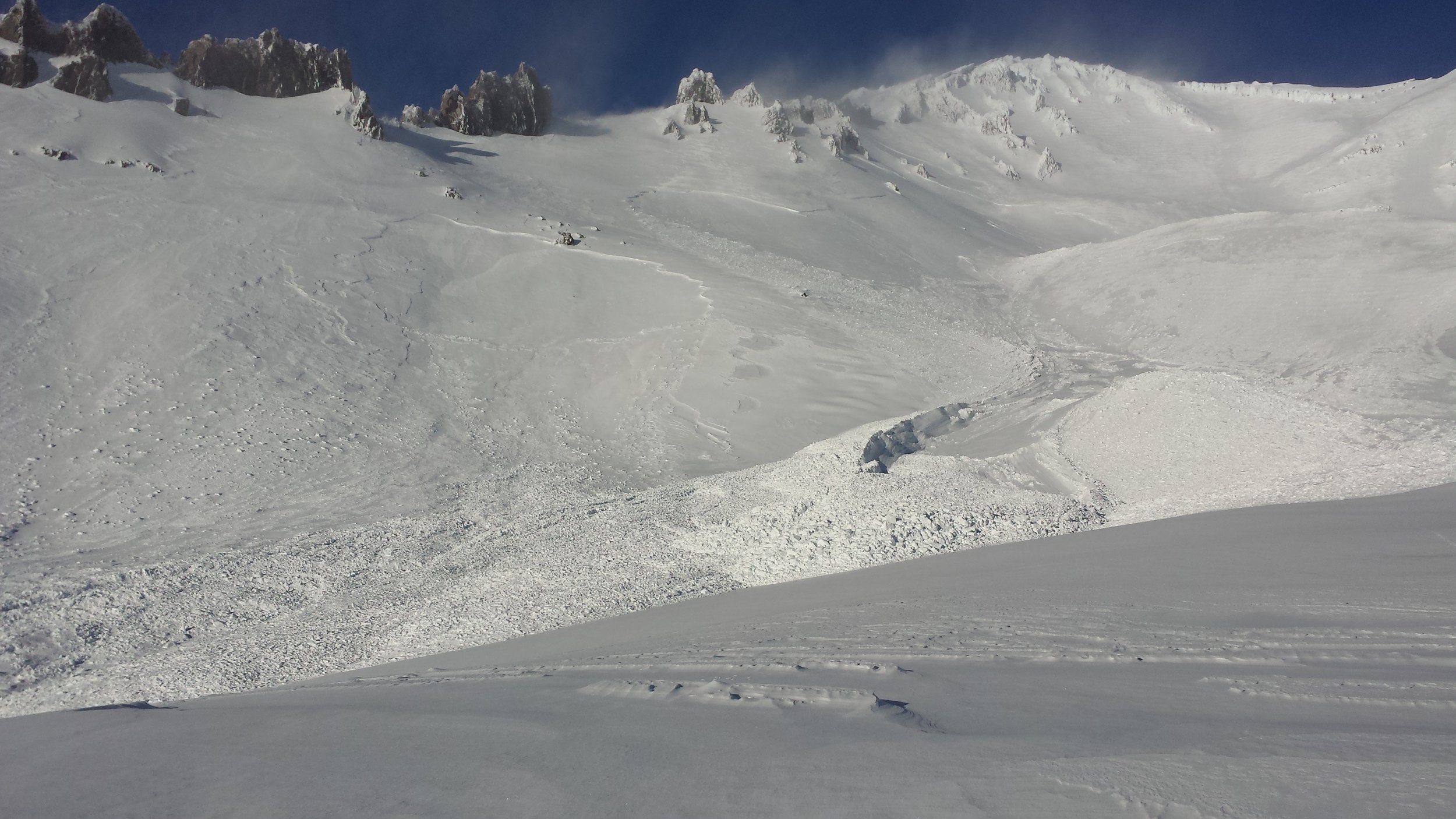 Mt shasta with avalanches on its slopes