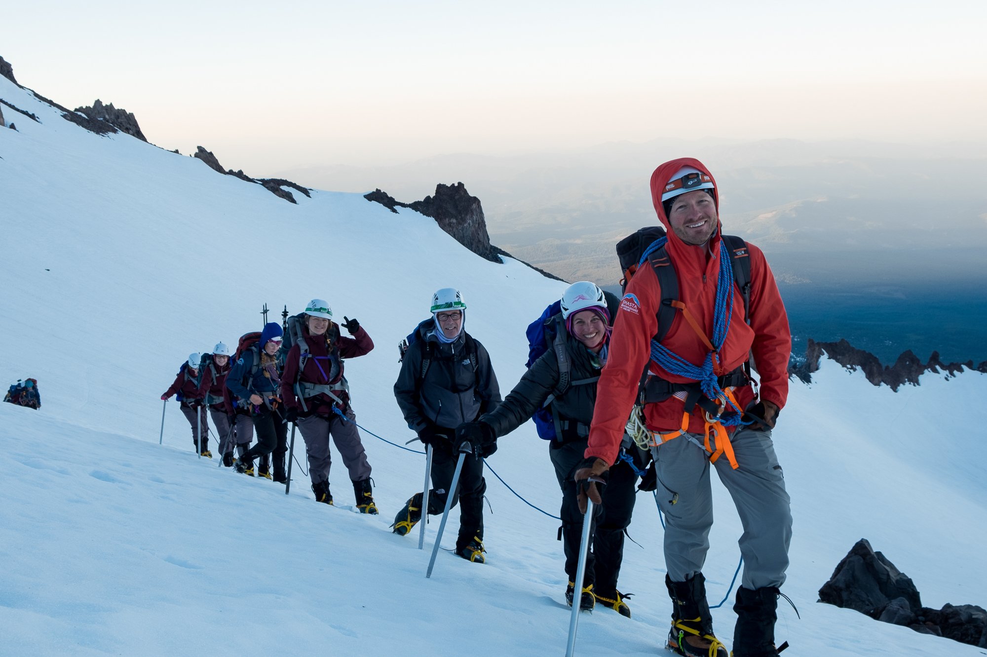 SMG guide Nick Caselli guides a group of mountaineers of Avalanche gulch on the south face of mt shasta