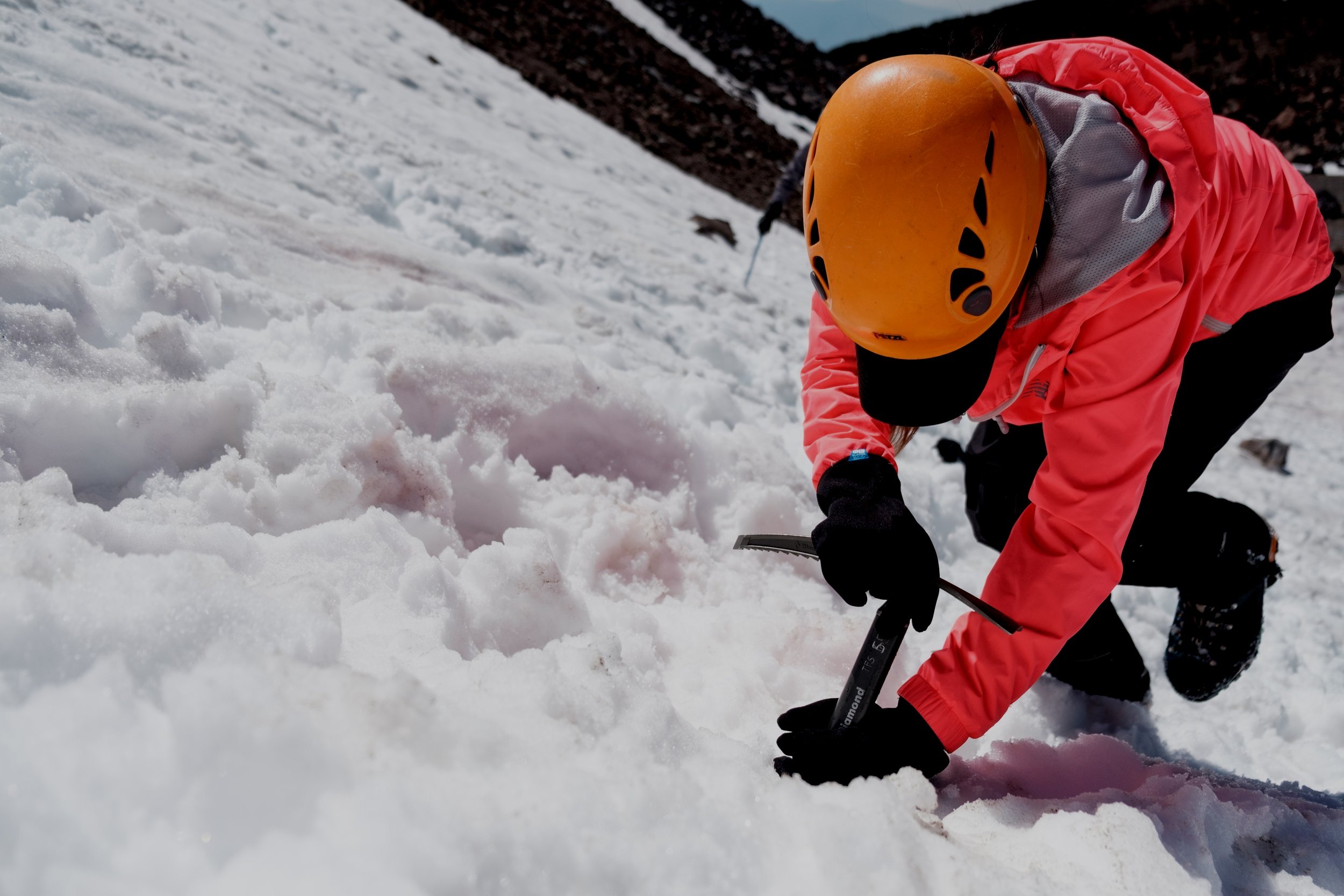 Course participants learn how to use an ice axe on mt shasta