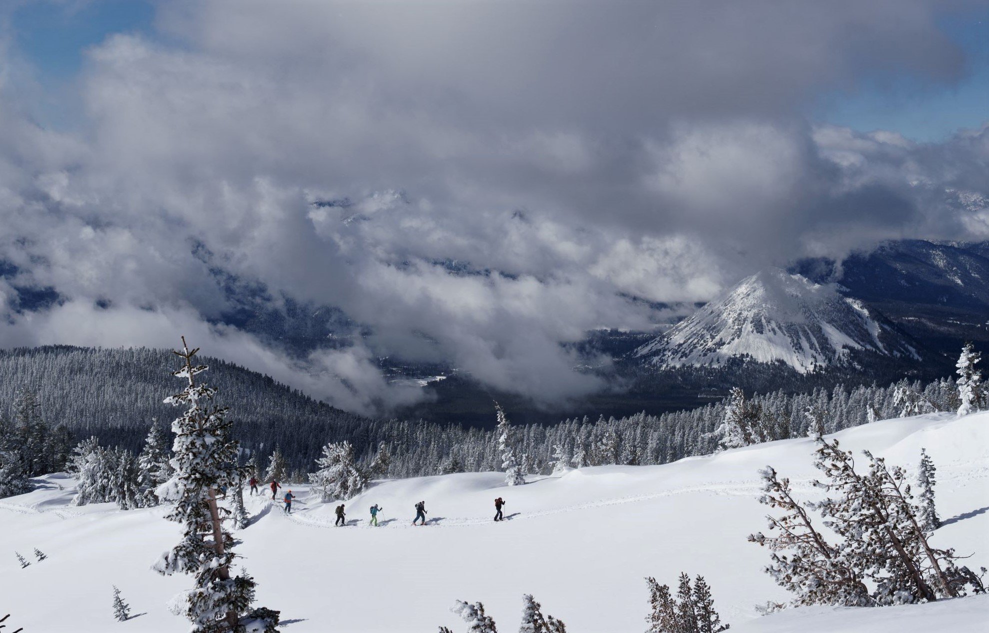 Skiers touring on the backcountry slopes of mt shasta