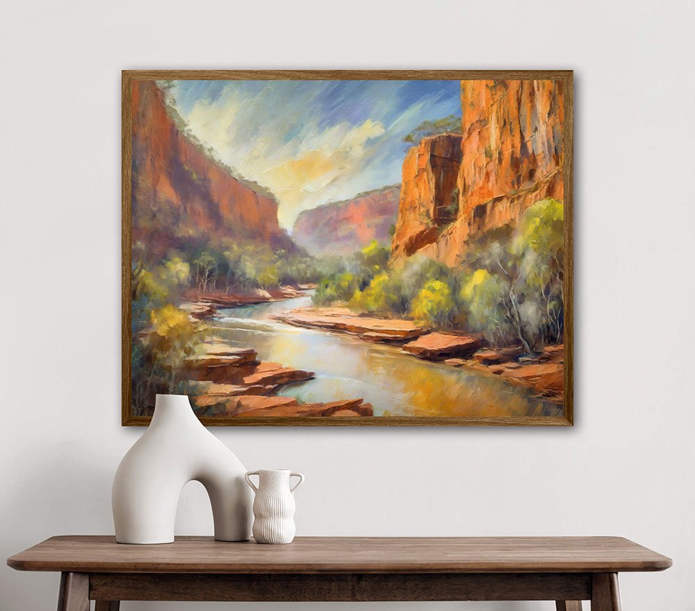 Artwork of Katherine Gorge with towering cliffs and river, displayed above a wooden table with white vases.