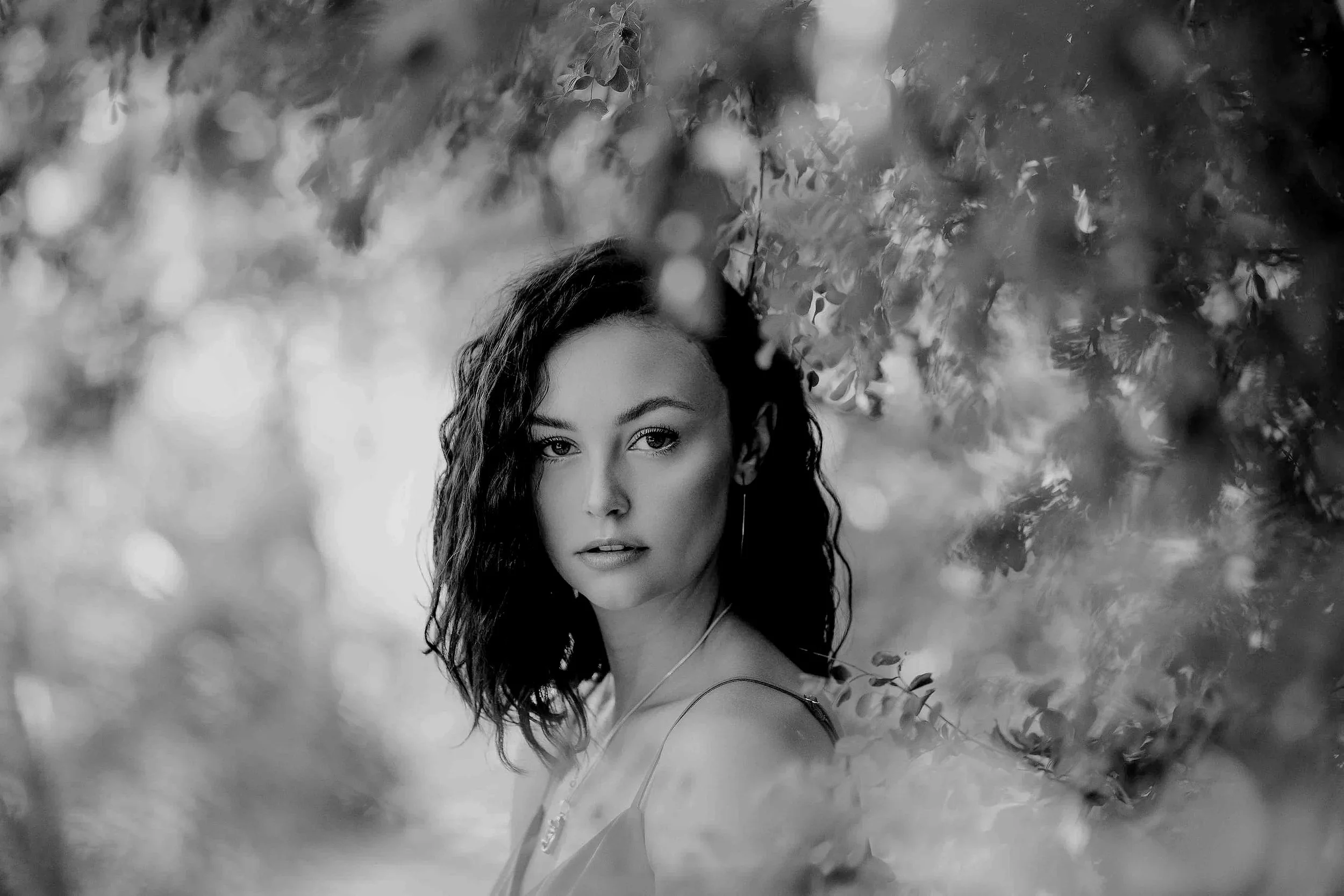 Model portrait photo of a woman at Roxboro & Erlton Dog Park in Calgary during the summer time