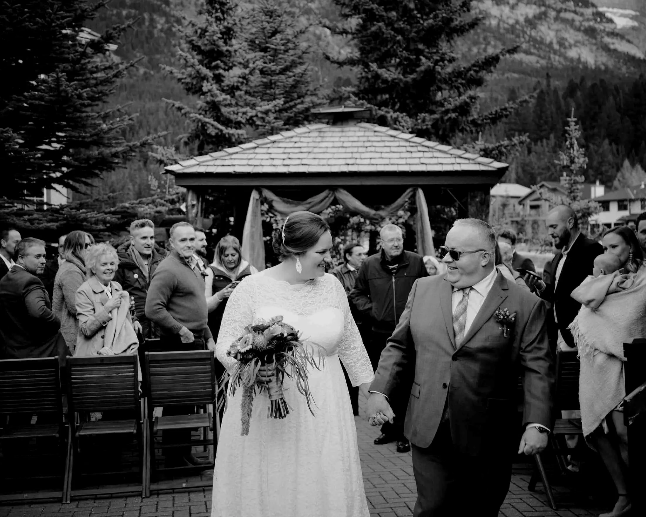 Wedding photo of newly wed couple at Bear & Bison Inn  in Canmore, Alberta