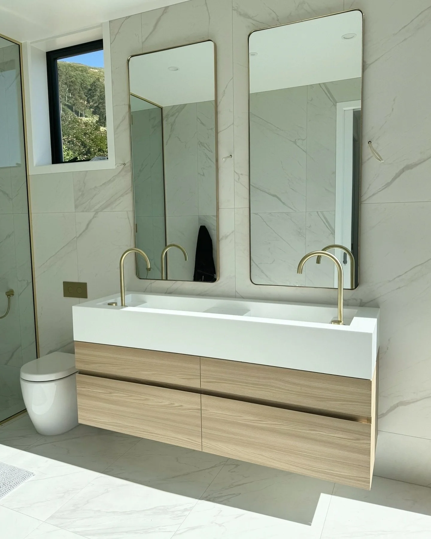 Site progress - utterly obsessed with the yummy combination of Carrara, American oak and brass for this en-suite at the Sowden residence. Also it would be rude not to mention the stunning ocean view from the shower, it was important to our clients th