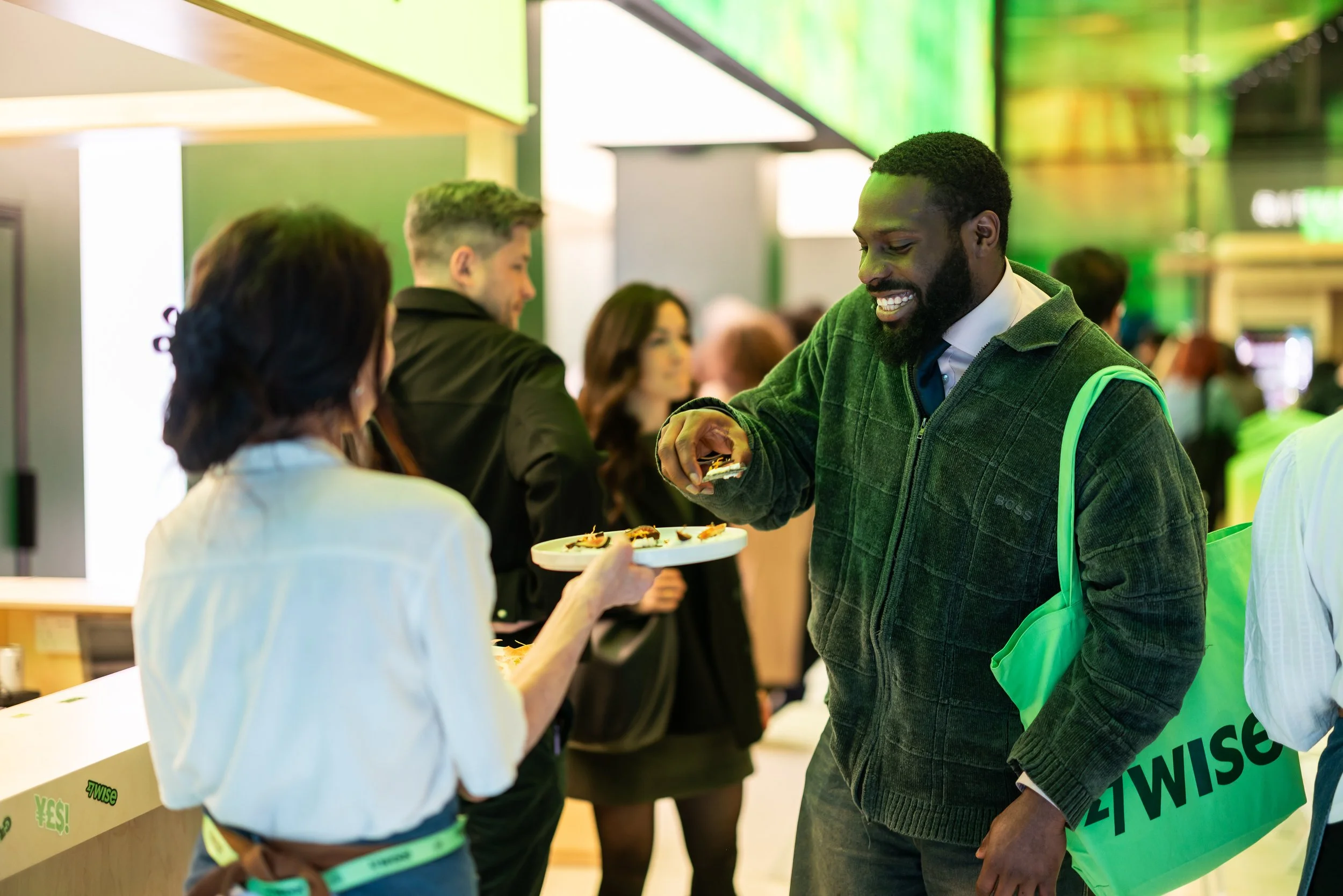 Guests taking canapés at a creative networking event for the finance brand Wise at Future Stores London on Oxford Street
