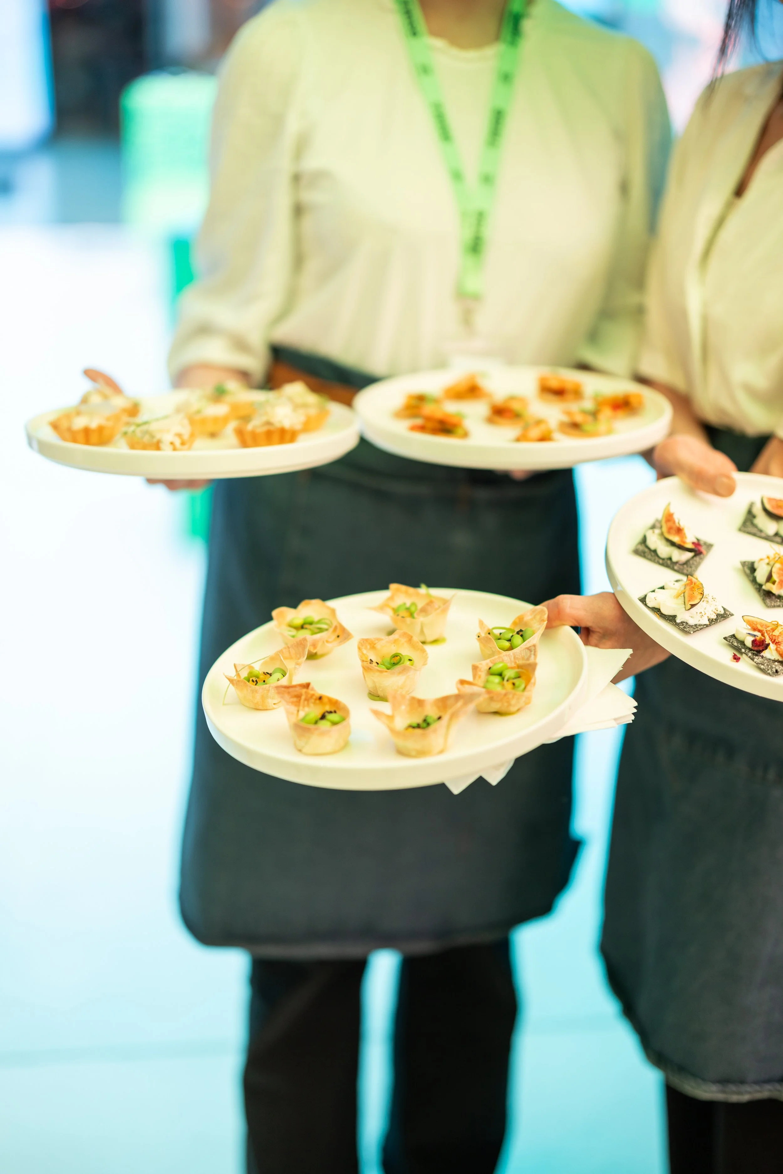 Staff serving canapés at a networking event for the finance brand Wise at Future Stores London on Oxford Street