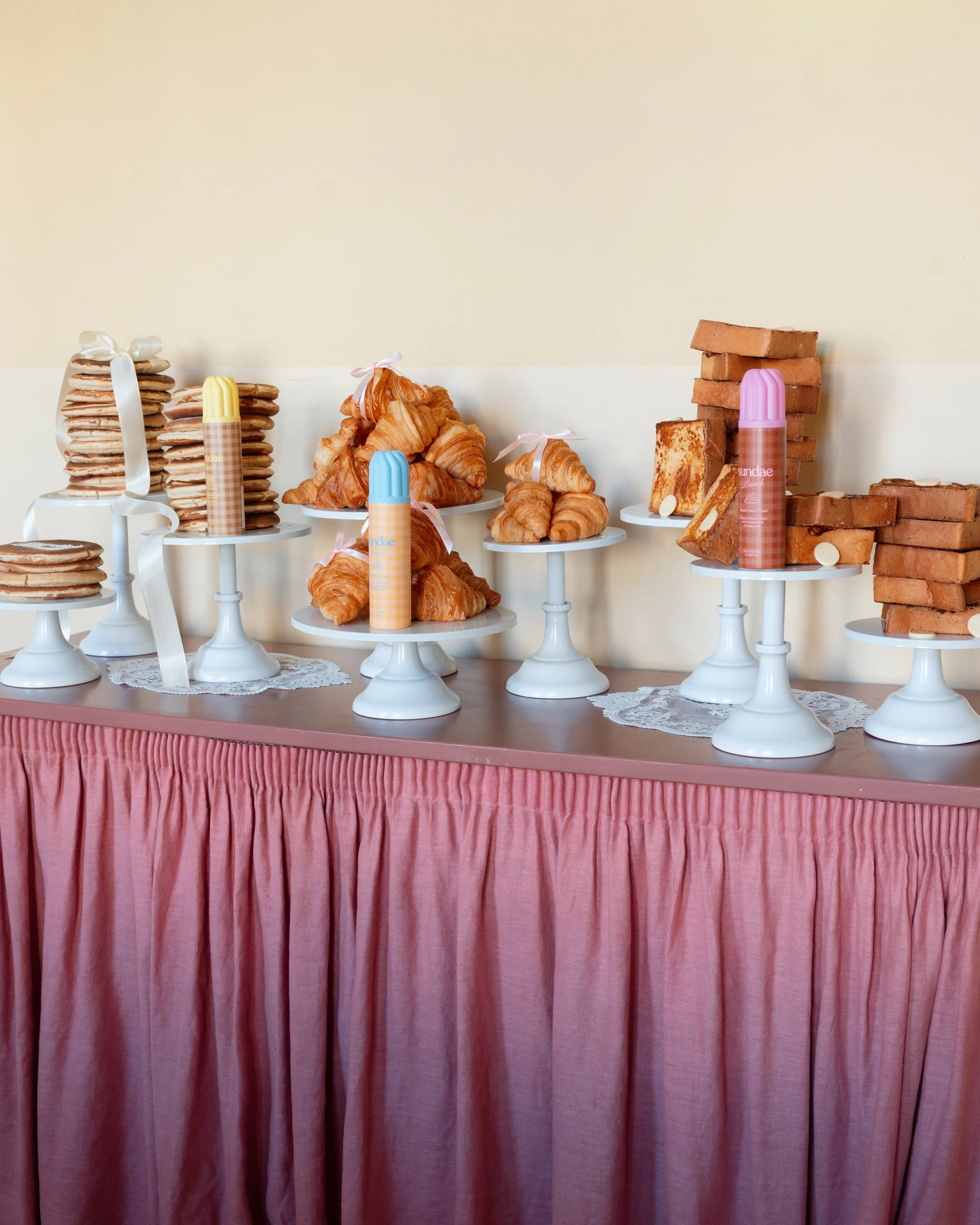 A pancake, croissant and French toast product tablescape at a product launch event at Somerset House in London for the brand Sundae
