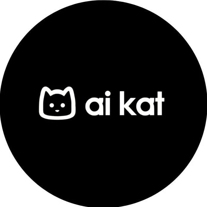 Black circular logo with a cute cat face outline and the text 'ai kat' in white.