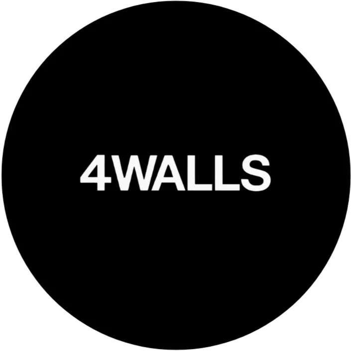 Black circular logo with white text reading '4WALLS' inside.