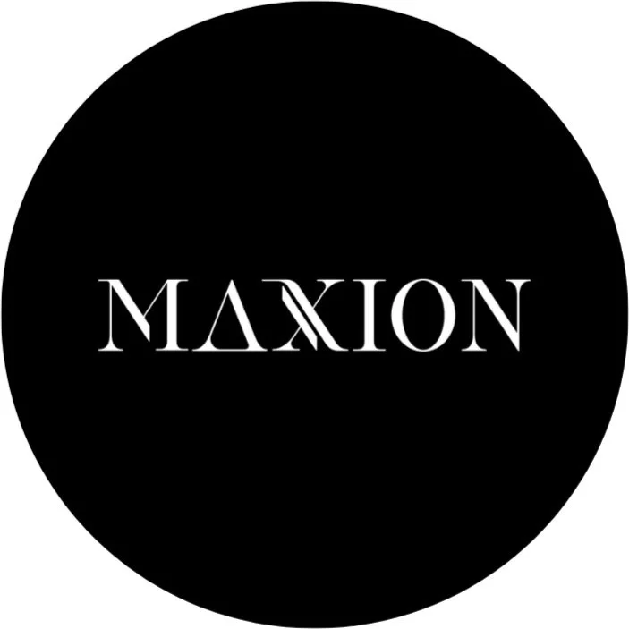 Black circular logo with the word 'MAXION' in white, stylized uppercase font.