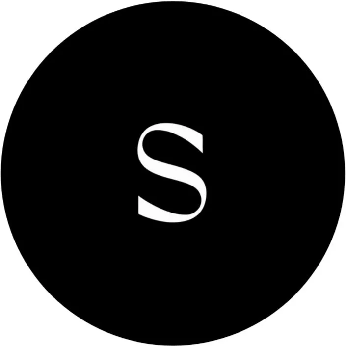 Black circle with a white letter S in the center.