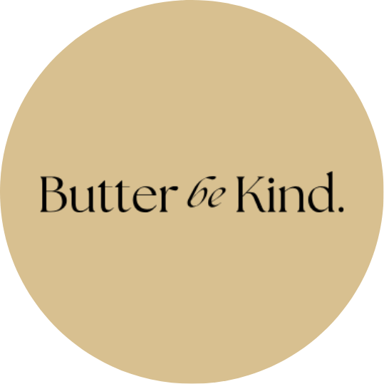 A circular beige background with black text that says 'Butter be Kind.'