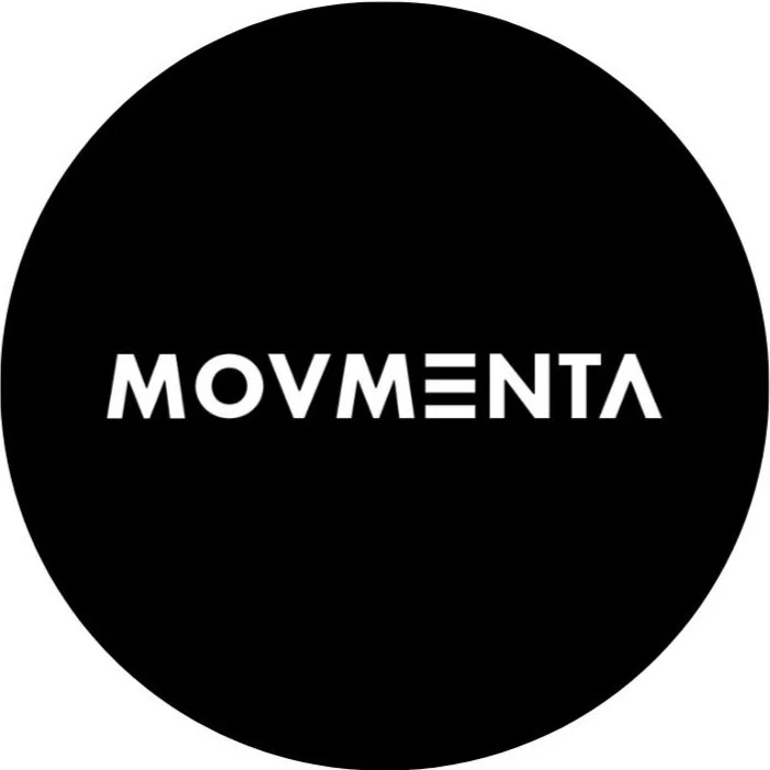 A black circular logo with the word 'MOVEMENT' in white, stylized text in the center.