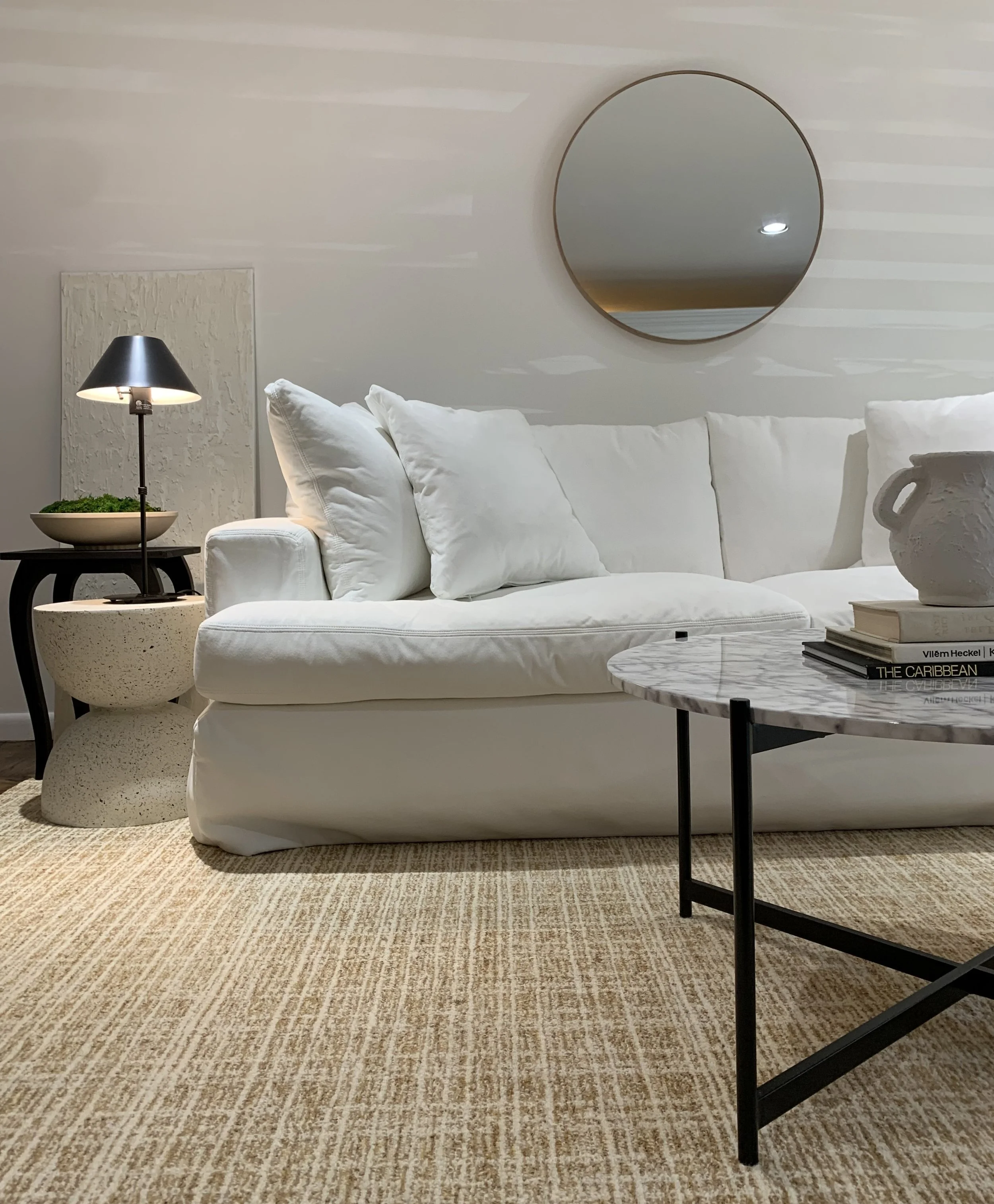 Modern family room featuring structured moss as a botanical element, adding texture and grounding presence to the space.