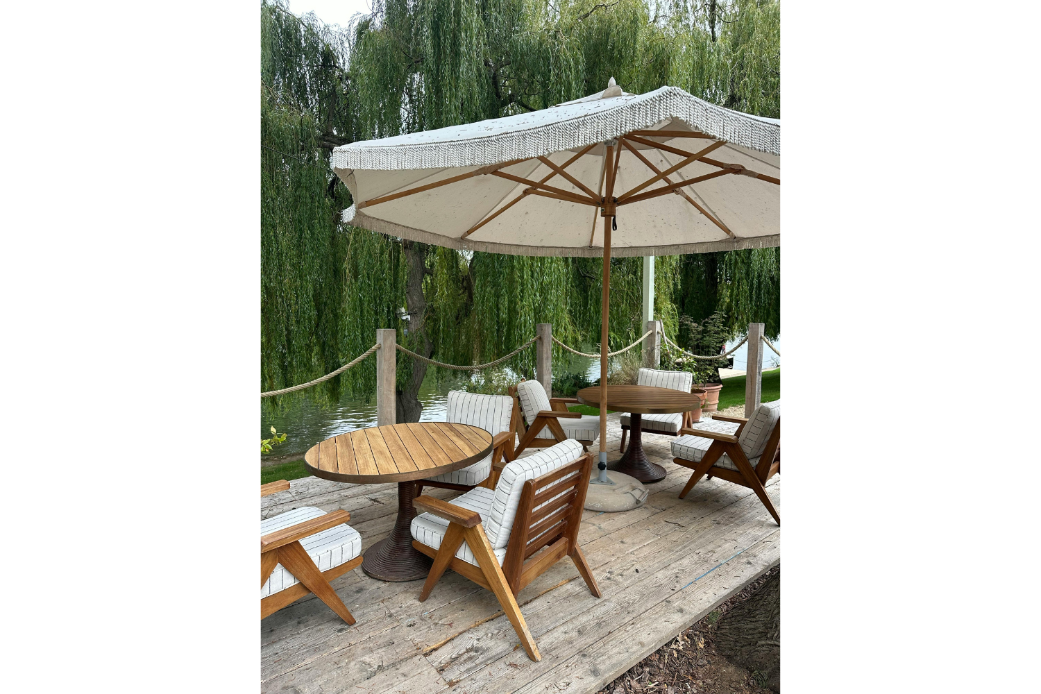 Outdoor chaise lounge with striped upholstery and textured cushions