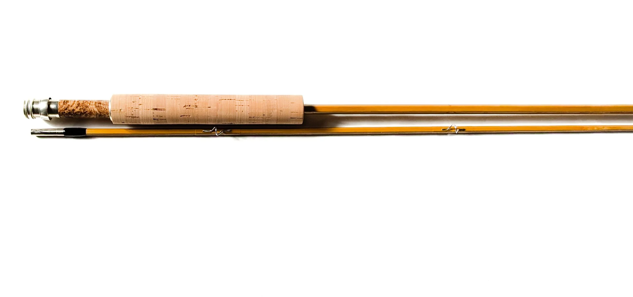 A fishing rod with a cork handle and a reel, laid flat on a white background.