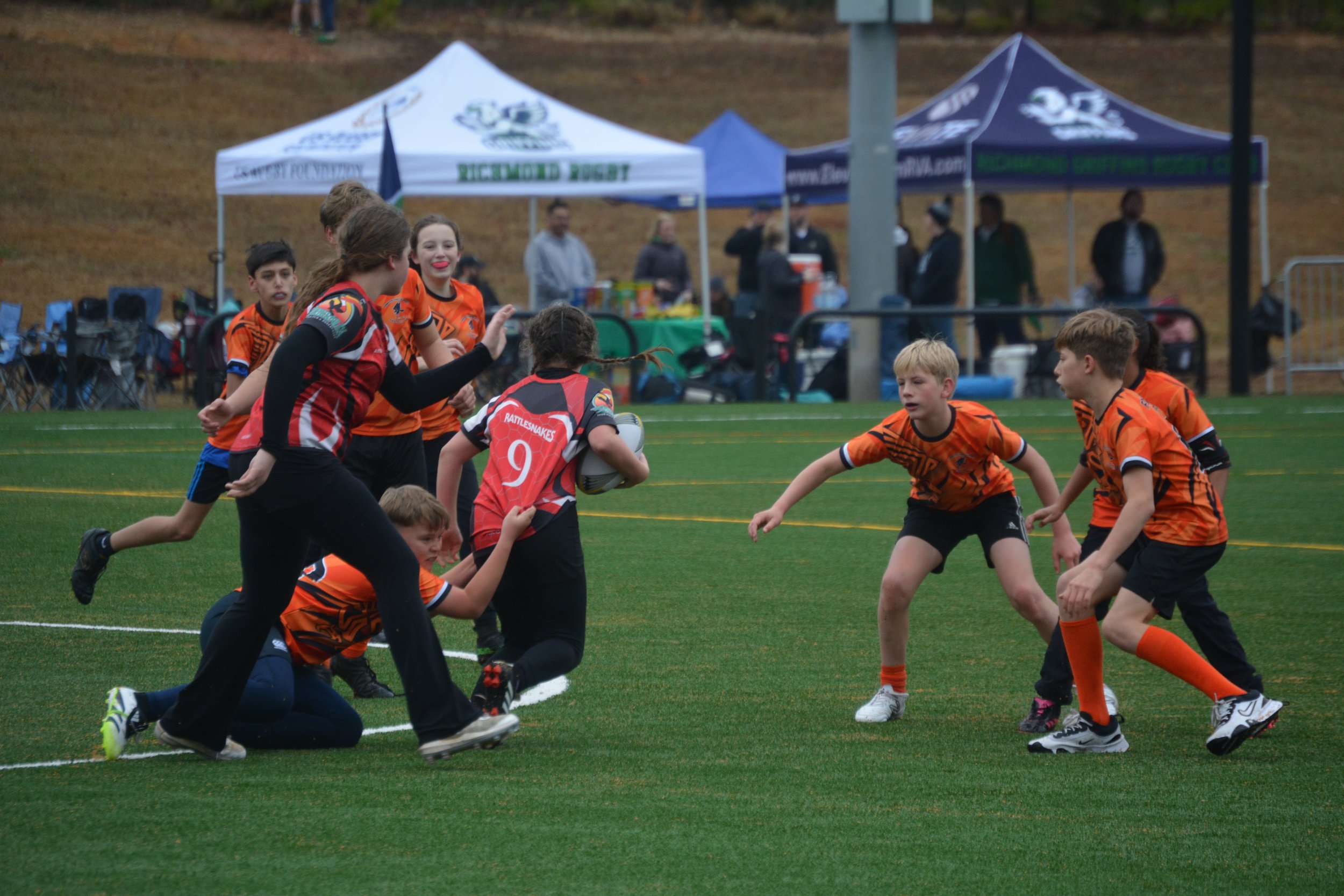 Forsyth Falcons Youth Rugby u-12 Team plays at North Carolina Ruggerfest in February. Sever children make a safe tackle. New players get to play the entire game and are welcome. u-12 rugby had an undefeated season and u-10 won ruggerfest