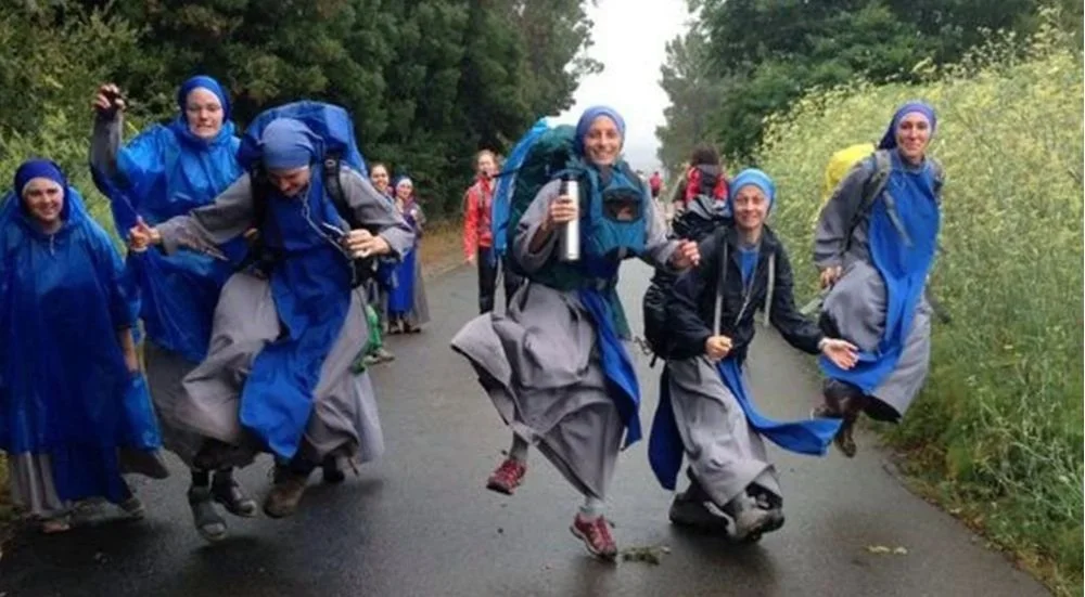 Nuns on the Camino de Santiago laughing and leaping for joy