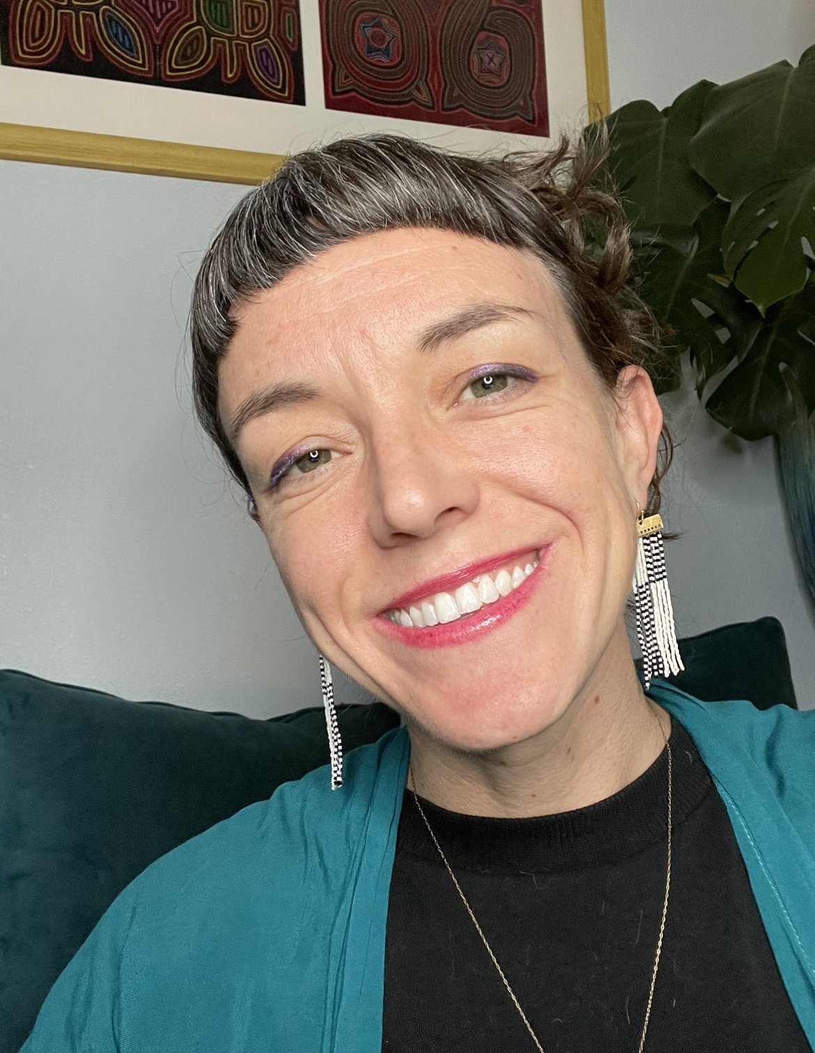 rev cindy clairvoyant healer mentorship and psychic sitting with blue shirt and earrings denver colorado