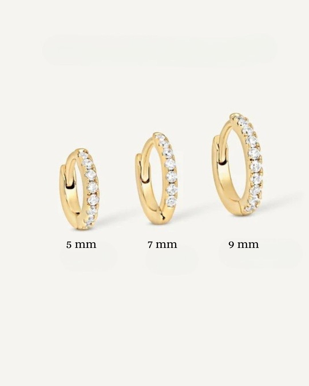 The Rachel huggie earring is your forever staple, crafted from 18k solid yellow gold and white moissanite stones, this beautiful earring is a must have for your luxury stack.